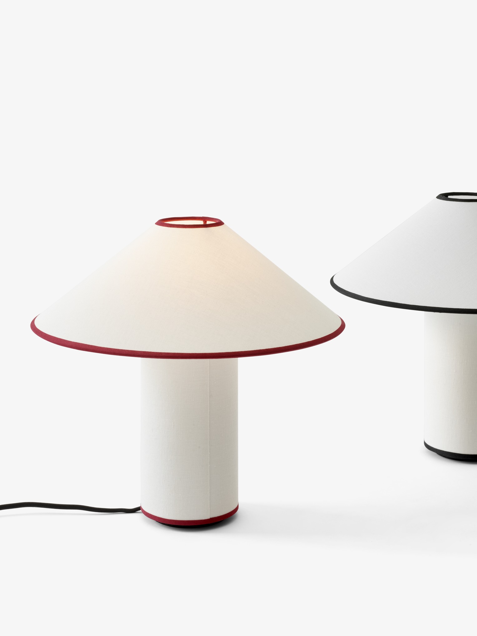 A couple of &tradition Colette Table Lamps sitting next to each other.